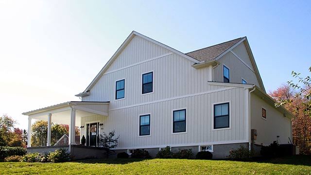 Exterior photograph of a modern farmhouse in Waterford, Connecticut