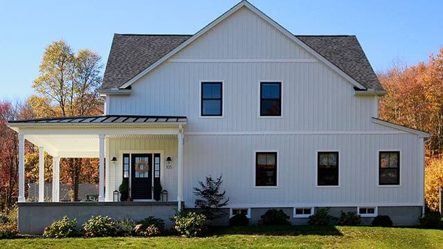 Exterior photograph of a modern farmhouse in Waterford, Connecticut
